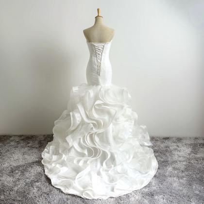 Ivory Floor Length Ruffle Trumpet Wedding Dress..