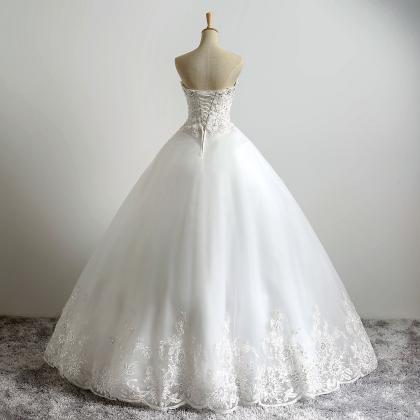 Ivory Floor Length Lace Tulle Wedding Gown..