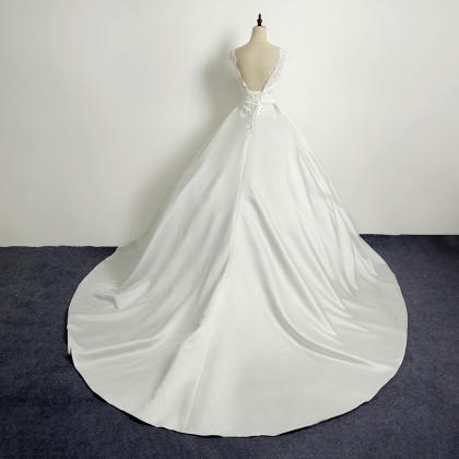 Ivory Floor Length Satin Wedding Gown Featuring..
