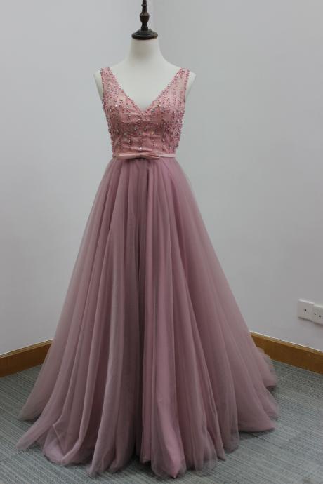 Pink Floor Length Tulle Formal Gown Featuring Sleeveless Plunge V Bodice with Beaded Embellishment, Bow Accent Belt and Open Back 